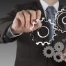 businessman hand show gear to success as concept